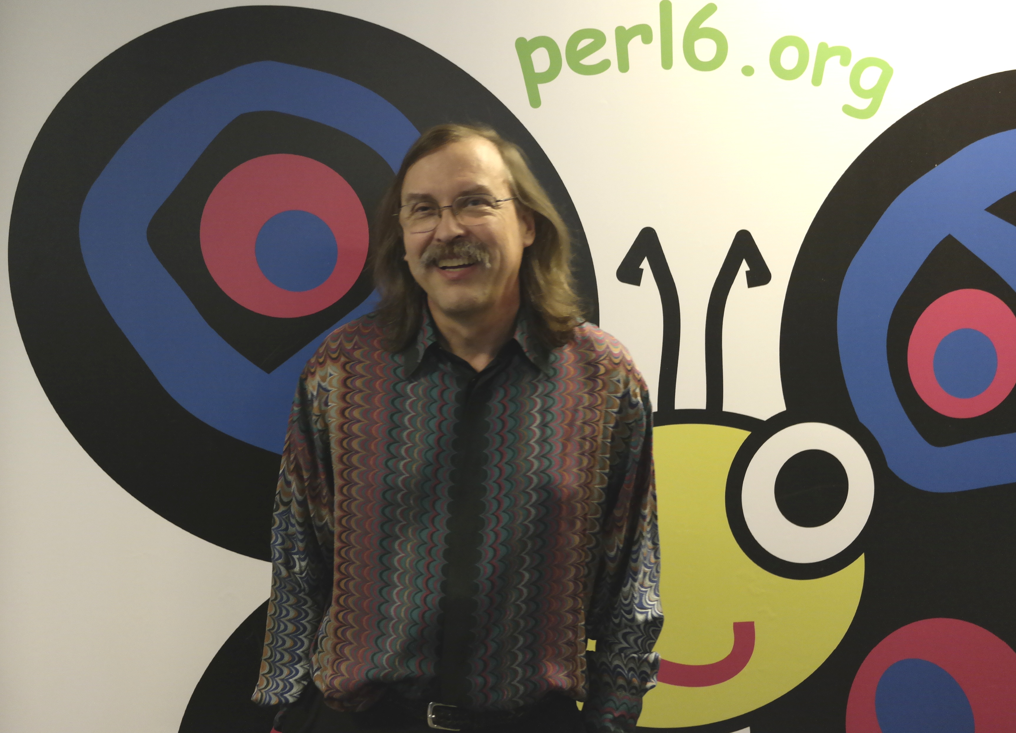 Larry Wall and Camelia, the Perl 6 Mascot